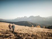 Two people walking along a hiking trail
